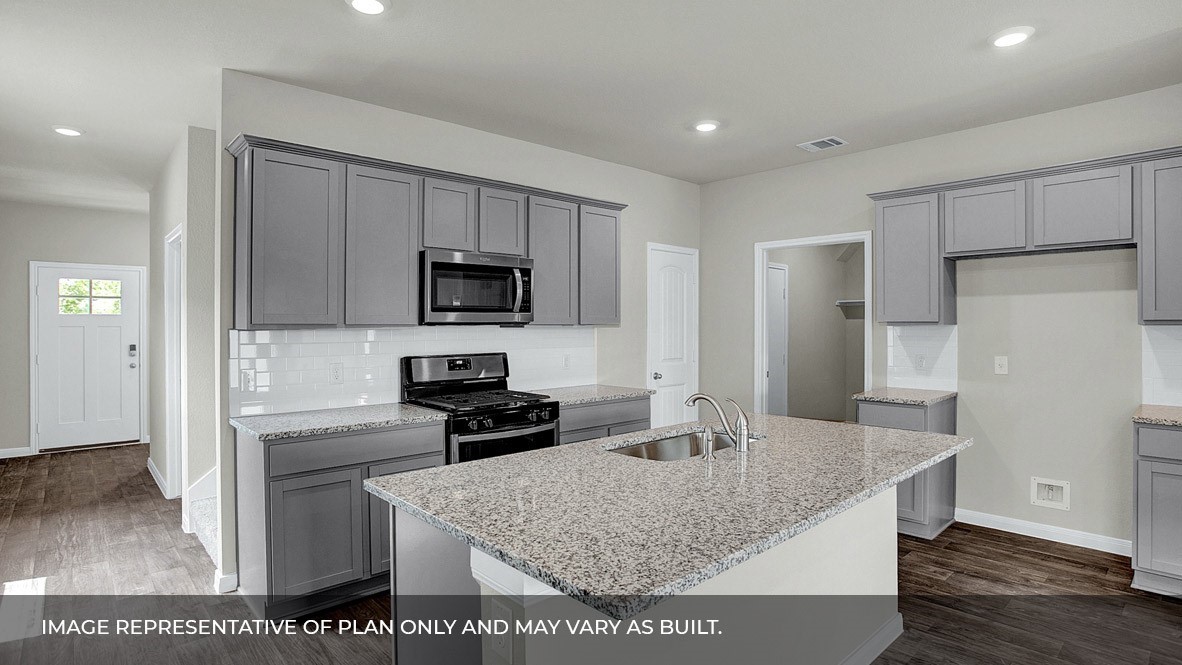 407 Robin Court Angleton, TX 77515 - Photo 3 of 22 a kitchen with stainless steel appliances granite countertop a refrigerator a stove and a sink