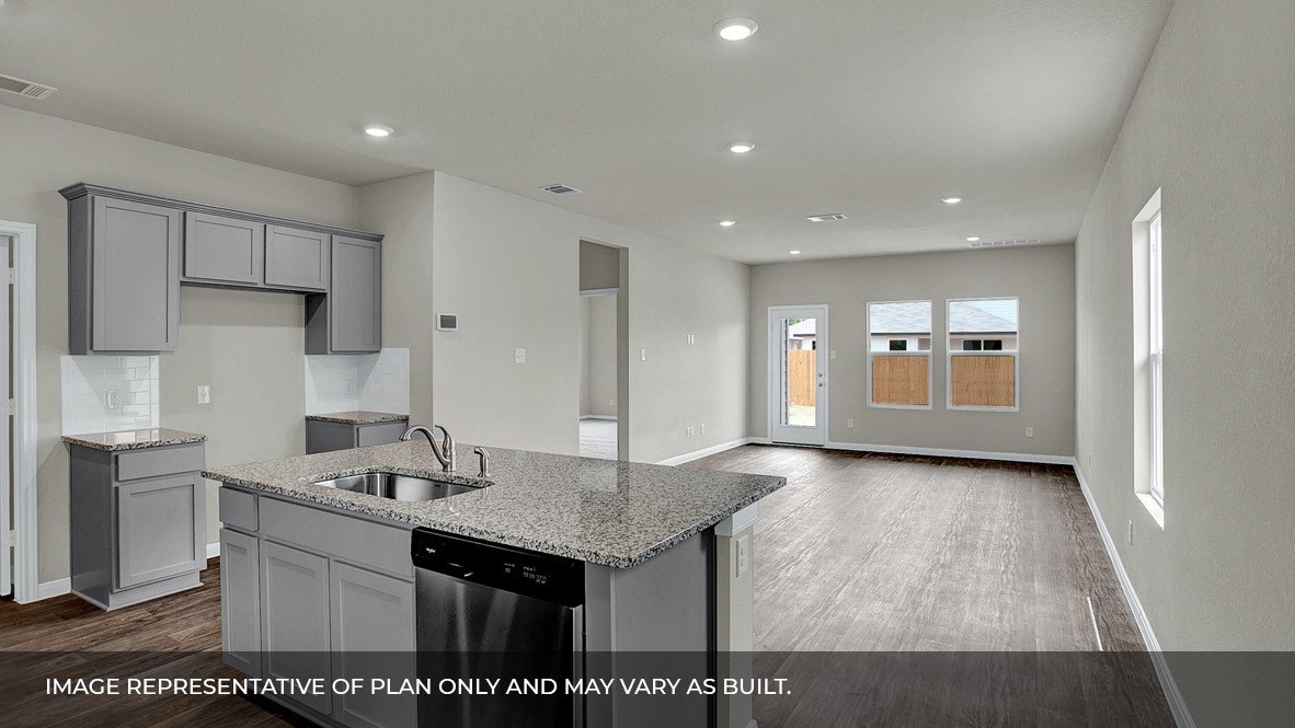 407 Robin Court Angleton, TX 77515 - Photo 4 of 22 a kitchen with a sink refrigerator and cabinets