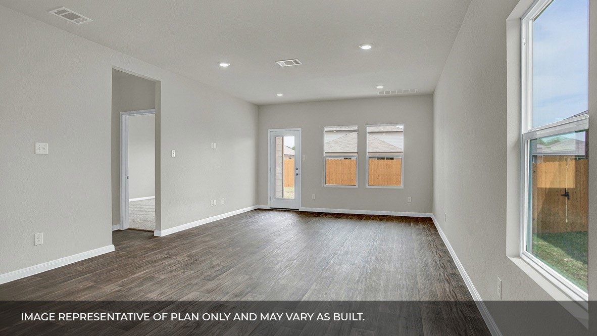 407 Robin Court Angleton, TX 77515 - Photo 6 of 22 a view of an empty room with wooden floor and a window