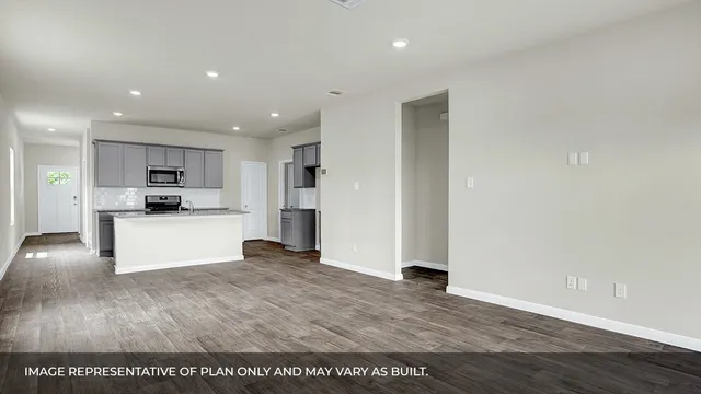 a view of kitchen with kitchen island microwave and stove