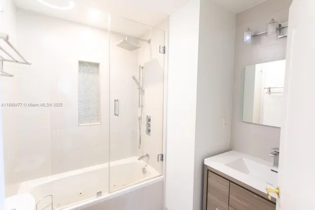 a view of a room with wooden floor and windows