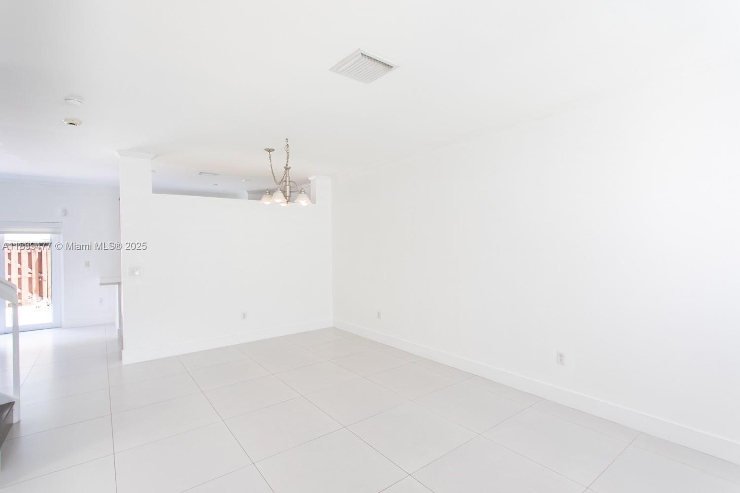 14219 Southwest 126th Place Miami, FL 33186 - Photo 5 of 26 a view of a room with an empty space