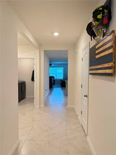 a kitchen with a refrigerator and cabinets