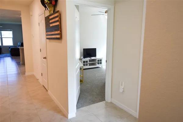 a bedroom with a bed and dresser with mirror