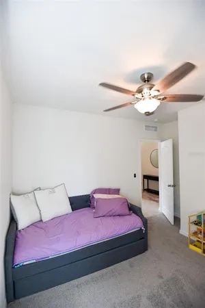 a large white kitchen with stainless steel appliances