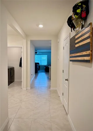 a view of walk in closet with clothes