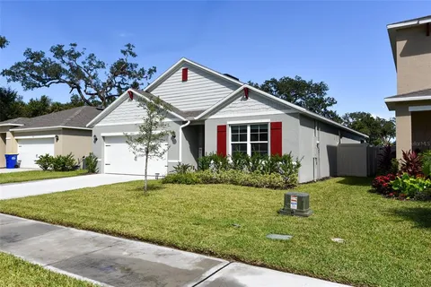 a view of a house with a small yard