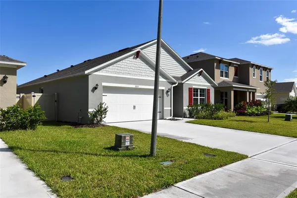 a view of a pathway of a house with backyard