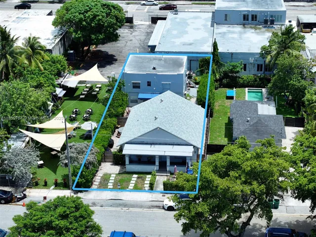 an aerial view of a house with a garden
