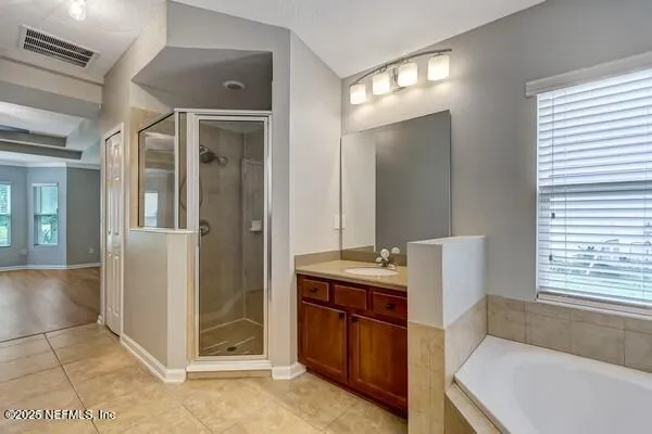 a kitchen with kitchen island granite countertop a stove a sink and a refrigerator