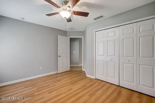 a view of a kitchen with a sink and refrigerator