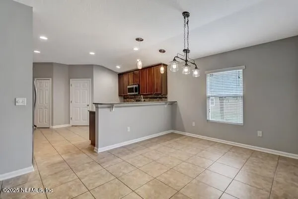 a kitchen with counter top space cabinets and stainless steel appliances