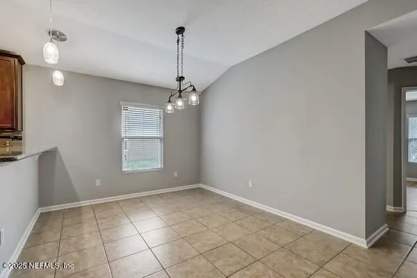 a kitchen with a sink a counter top space cabinets and stainless steel appliances