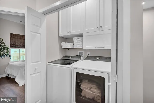 a kitchen with a stove and a white cabinet