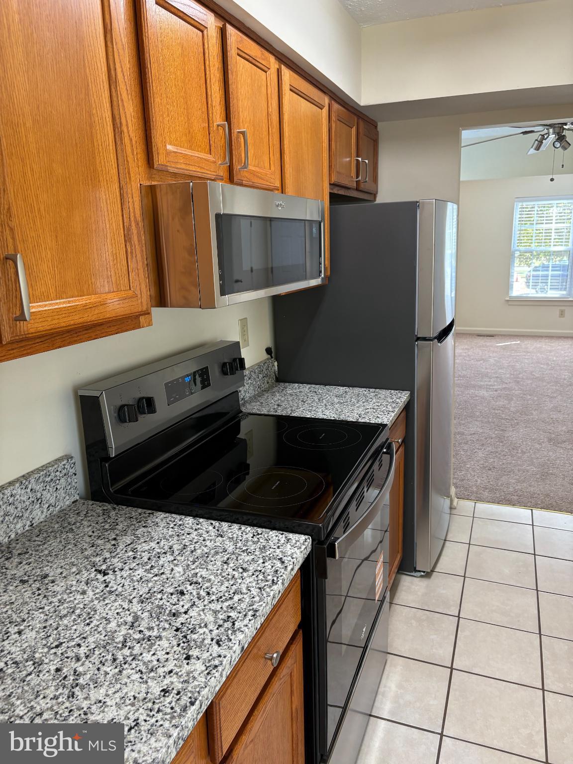 4342 Downs Square Belcamp, MD 21017 - Photo 8 of 30 a kitchen with a sink a stove top oven a counter space and a window