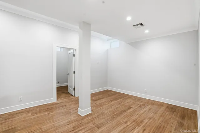wooden floor in an empty room with a gallery