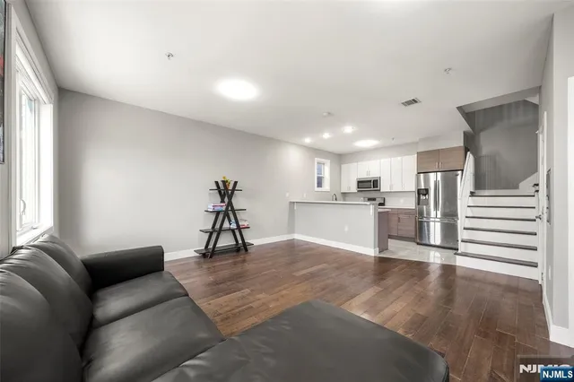 a kitchen with a sink stove and microwave