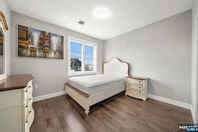 a bedroom with a bed and a closet