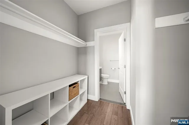 a spacious bedroom with a bed and a large window