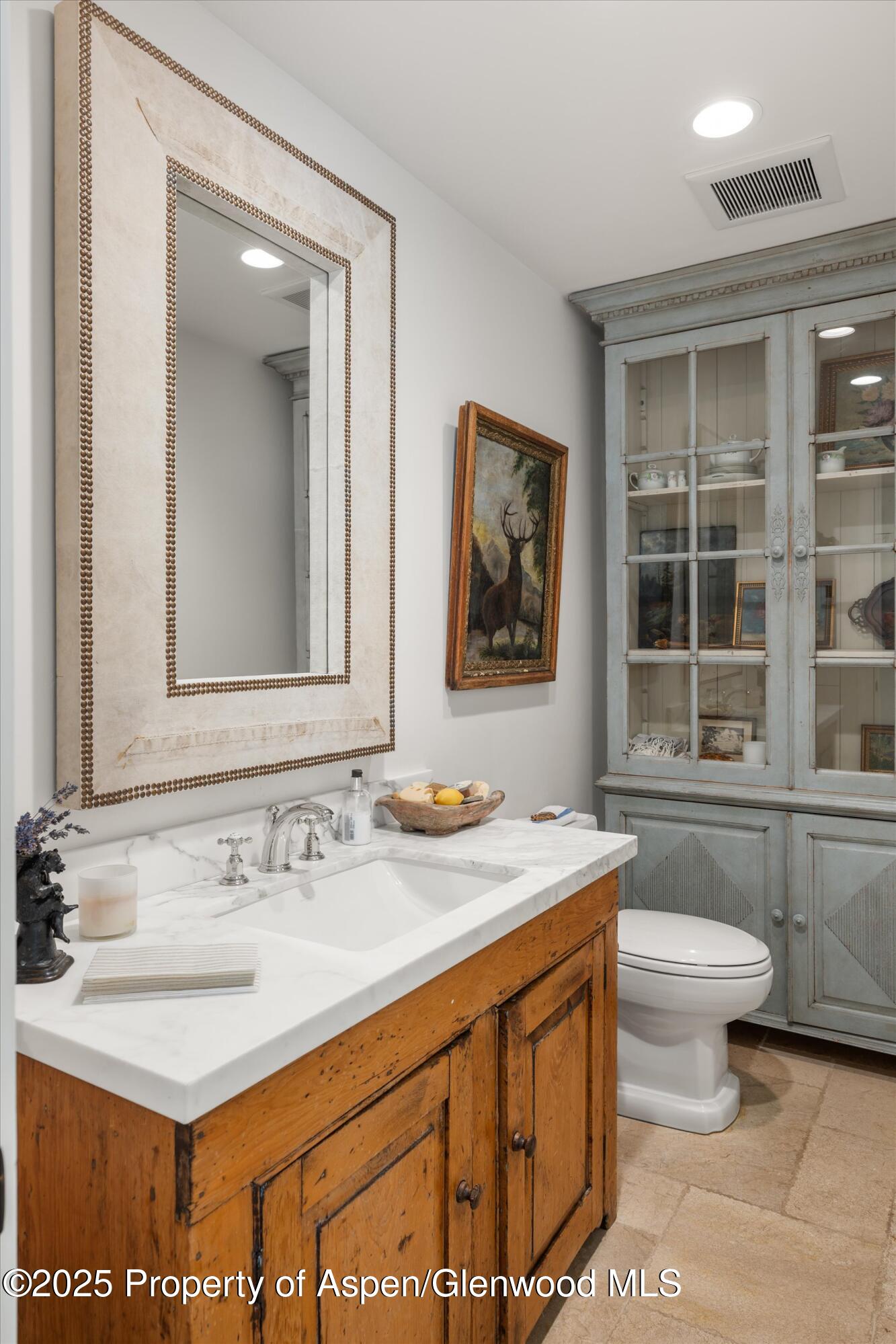 9555 Castle Creek Road Aspen, CO 81612 - Photo 13 of 42 a bathroom with a sink and a mirror