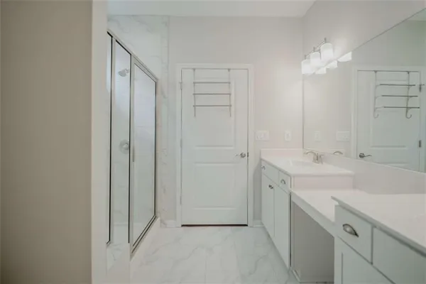 a bathroom with a double vanity sink and a mirror