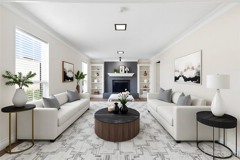 2145 Willow Place, Unit B Carrollton, TX 75006 - Photo 11 of 39 a living room with furniture a fireplace and a chandelier