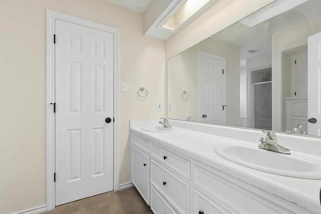 2145 Willow Place, Unit B Carrollton, TX 75006 - Photo 21 of 39 a bathroom with a sink and a mirror