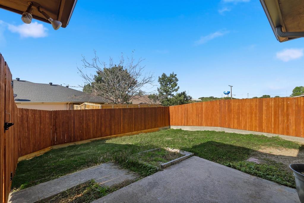 2145 Willow Place, Unit B Carrollton, TX 75006 - Photo 30 of 39 a view of a backyard with a cabin