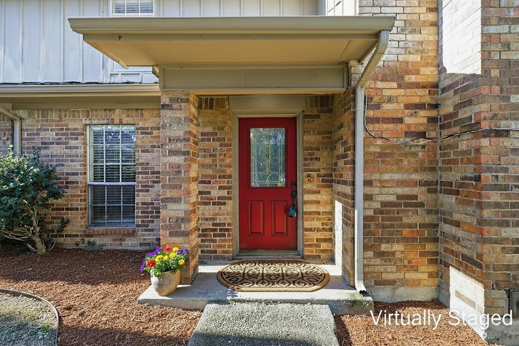 2145 Willow Place, Unit B Carrollton, TX 75006 - Photo 3 of 39 a front view of a house with a yard
