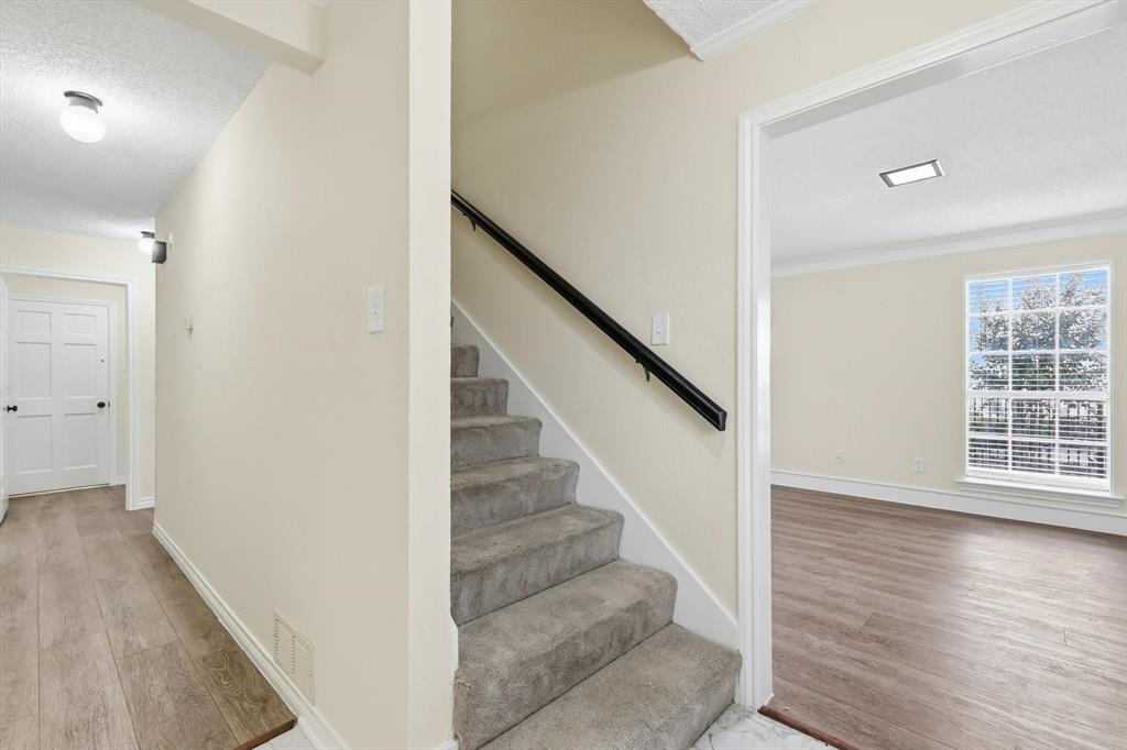 2145 Willow Place, Unit B Carrollton, TX 75006 - Photo 5 of 39 a view of entryway with wooden floor and stairs