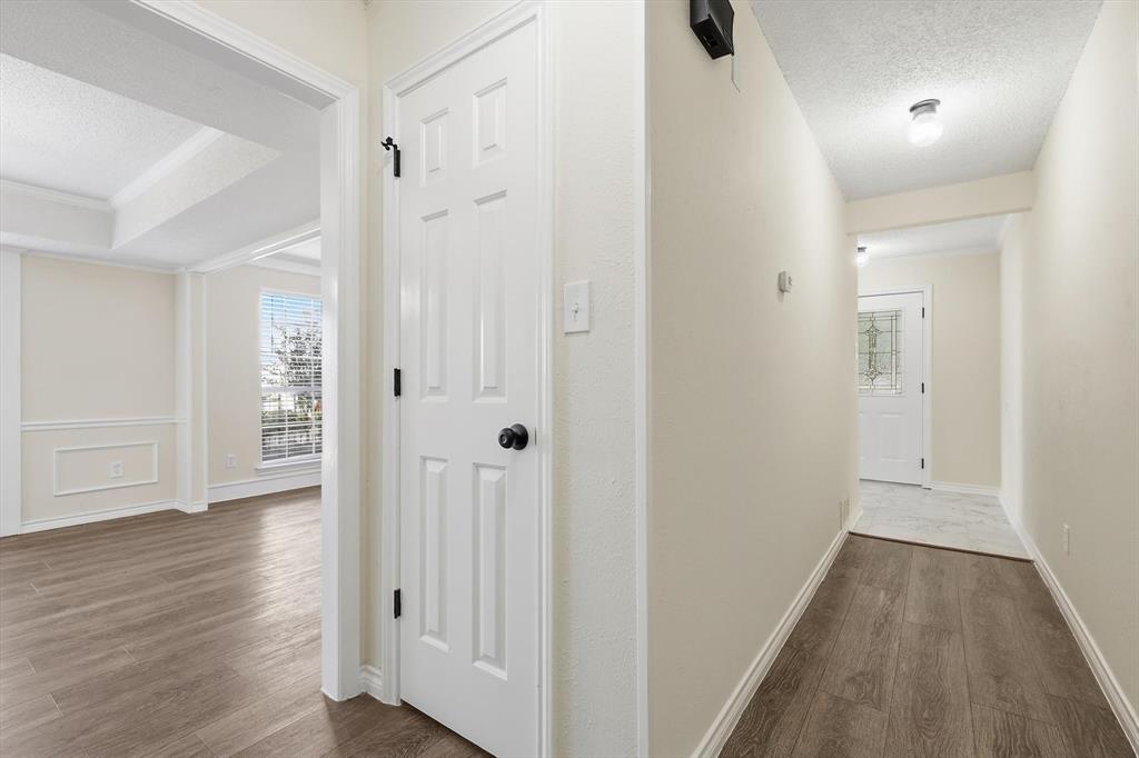 2145 Willow Place, Unit B Carrollton, TX 75006 - Photo 6 of 39 wooden floor with white walls