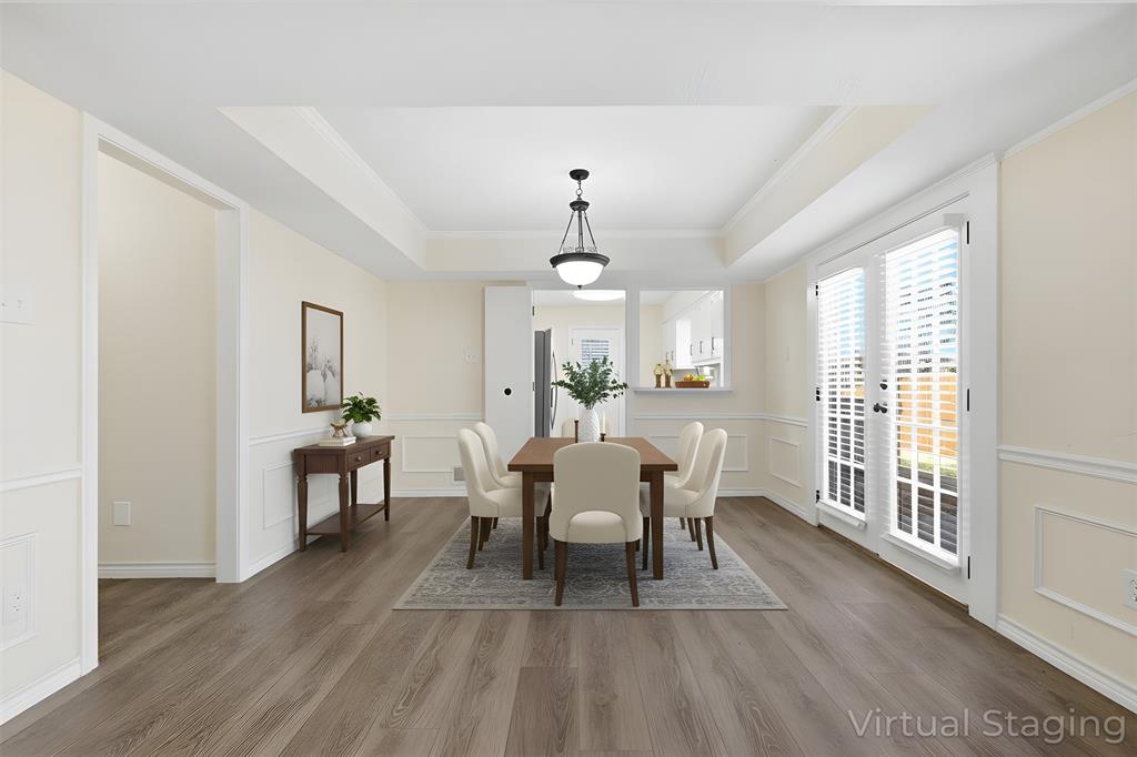 2145 Willow Place, Unit B Carrollton, TX 75006 - Photo 7 of 39 a view of a dining room with furniture window and wooden floor