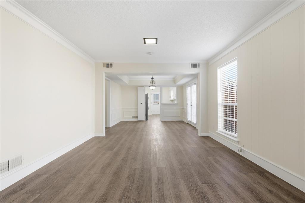 2145 Willow Place, Unit B Carrollton, TX 75006 - Photo 10 of 39 a view of a big room with wooden floor and windows