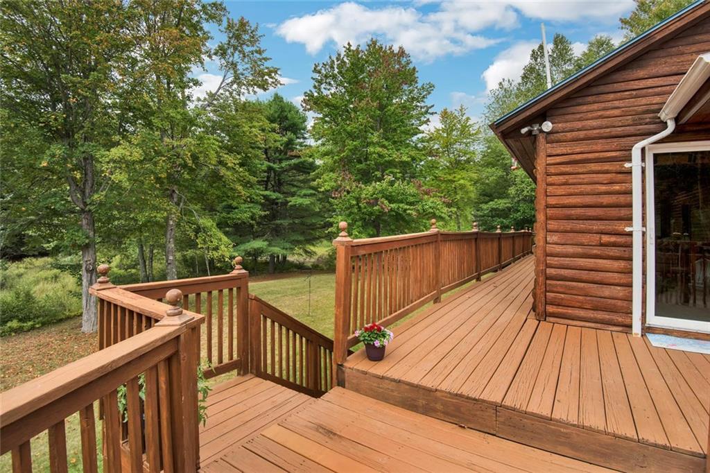 26 Webbs Mills Road Raymond, ME 04071 - Photo 27 of 34 Deck wraps around the river side of...