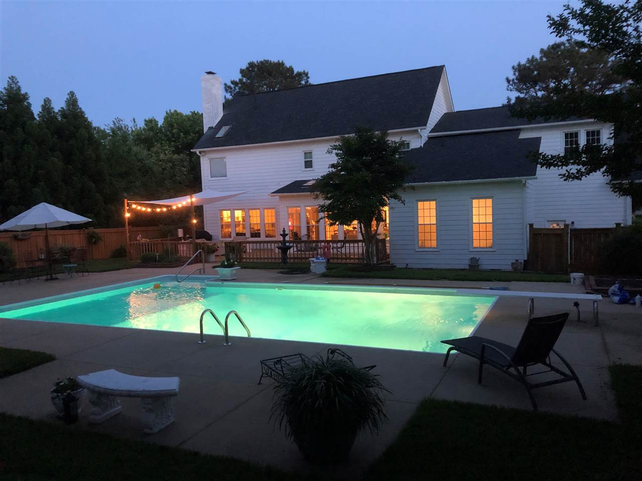 6916 Darcy Lane Raleigh, NC 27606 - Photo 30 of 30 Sellers photo of an evening by the pool in Summer. Swimming Pool/Hot Tub/Sauna