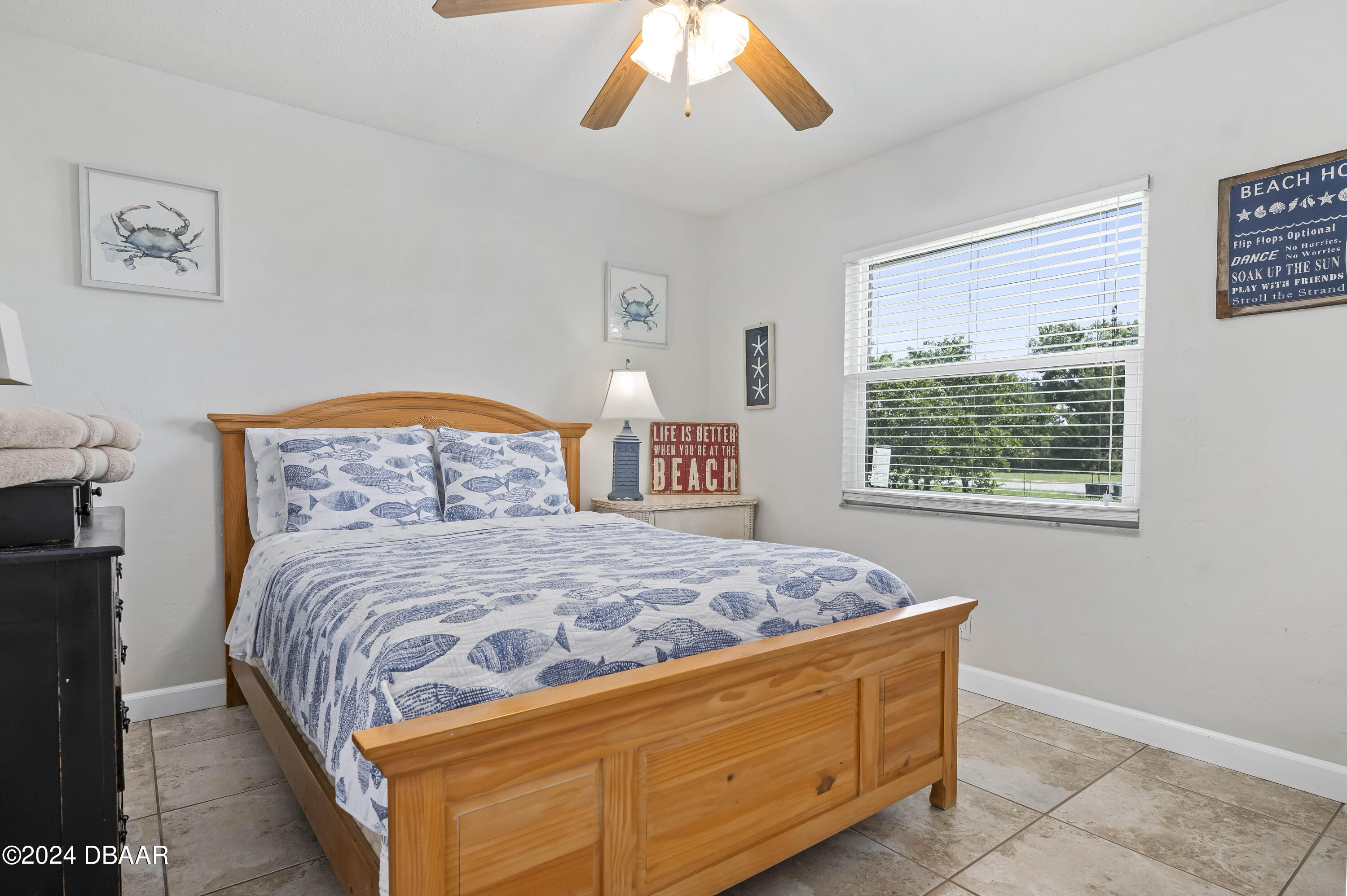 5528 Riverside Drive Port Orange, FL 32127 - Photo 21 of 31 a bedroom with a bed and a window