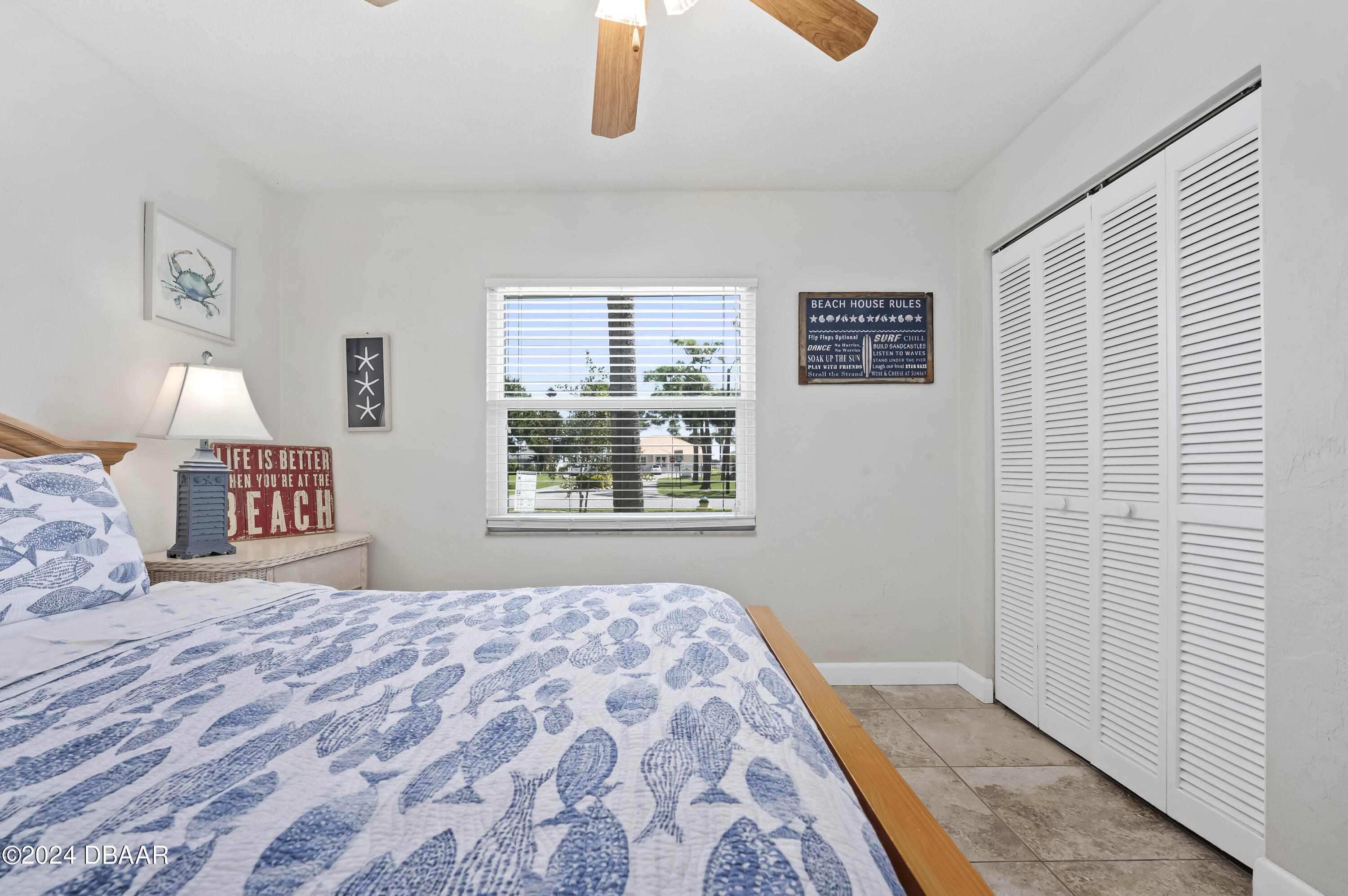 5528 Riverside Drive Port Orange, FL 32127 - Photo 22 of 31 a bedroom with a bed and a window