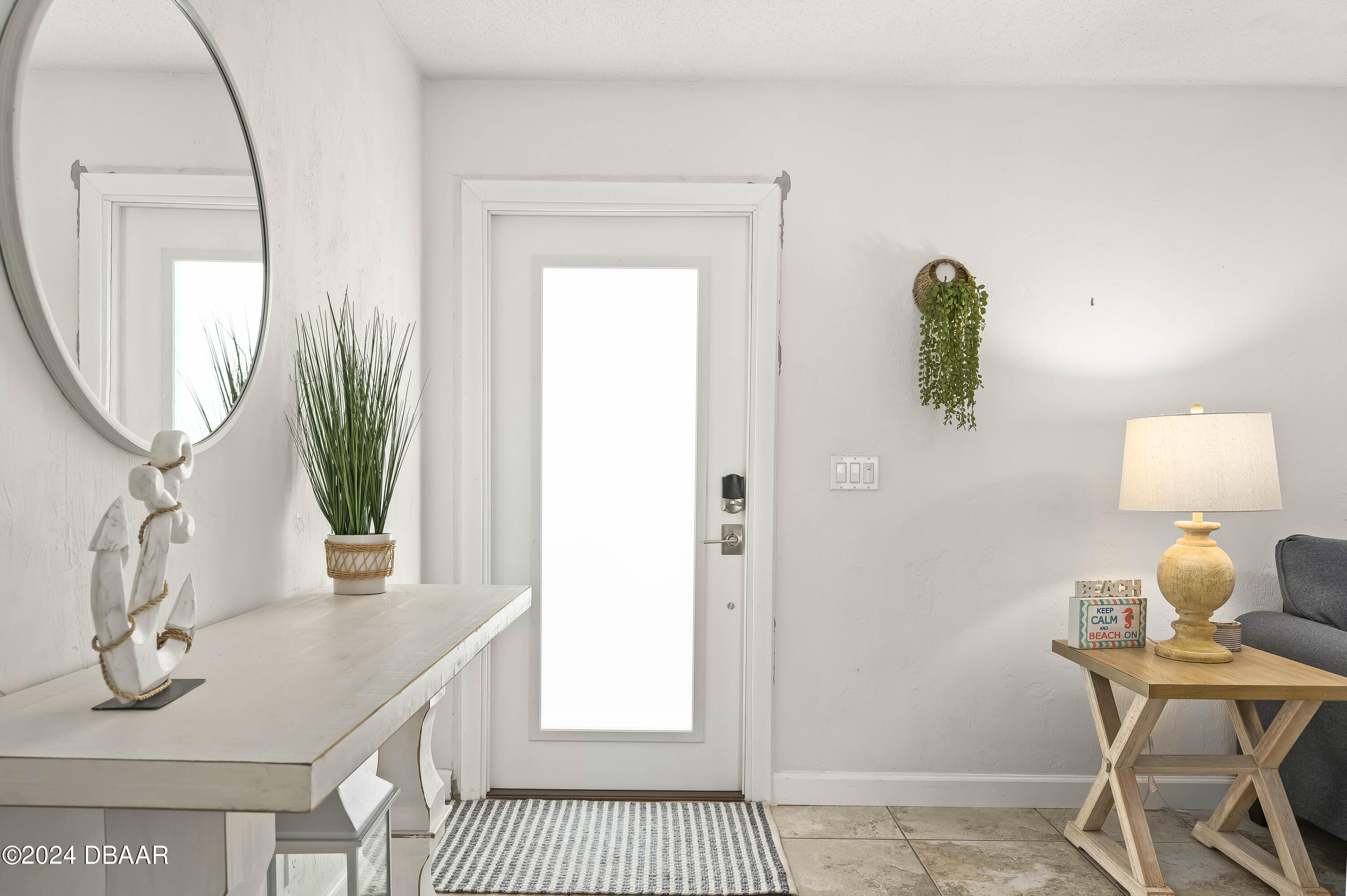 5528 Riverside Drive Port Orange, FL 32127 - Photo 4 of 31 a bathroom with a sink a mirror and a window