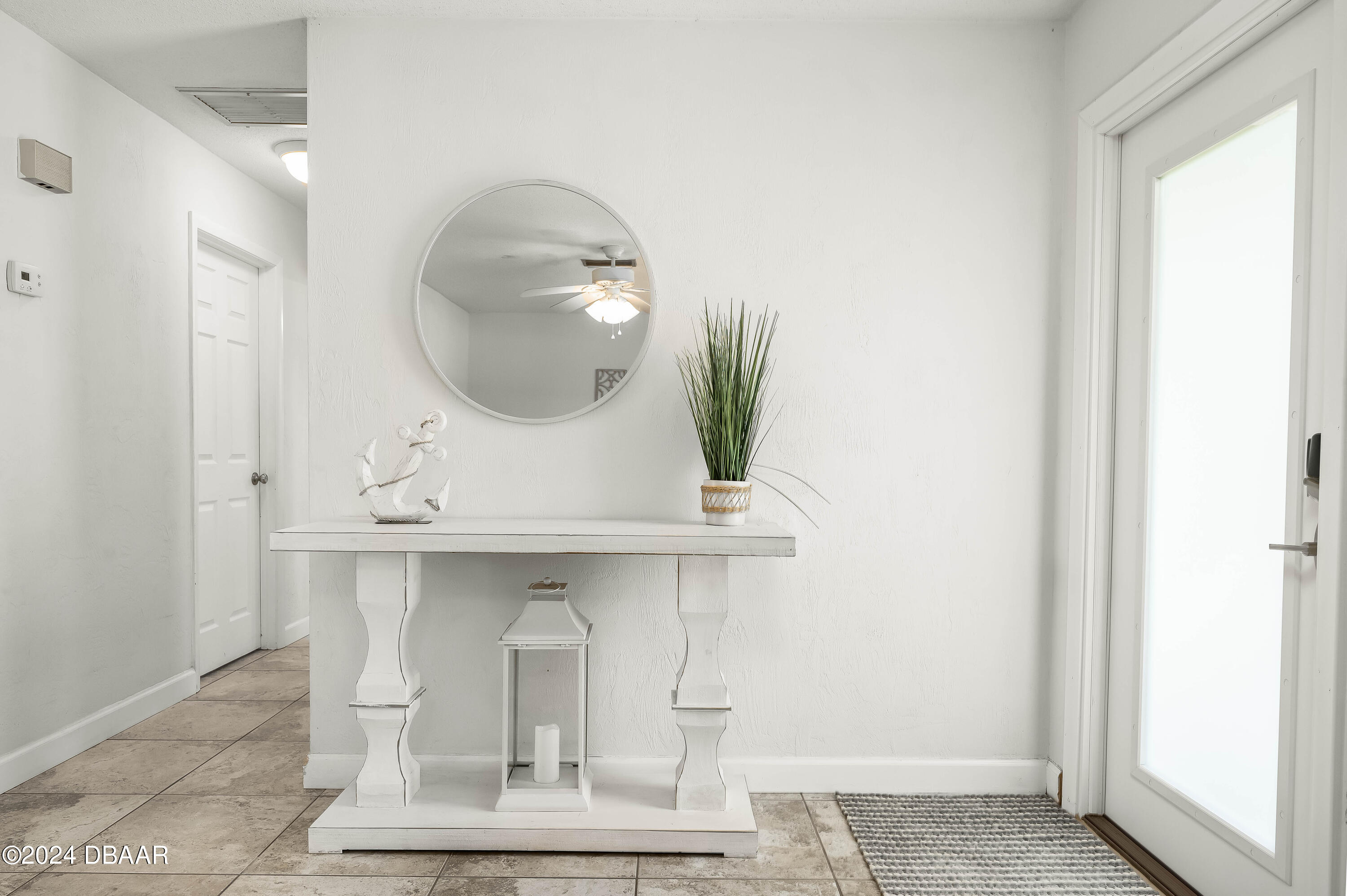 5528 Riverside Drive Port Orange, FL 32127 - Photo 5 of 31 a bathroom with a sink and a mirror
