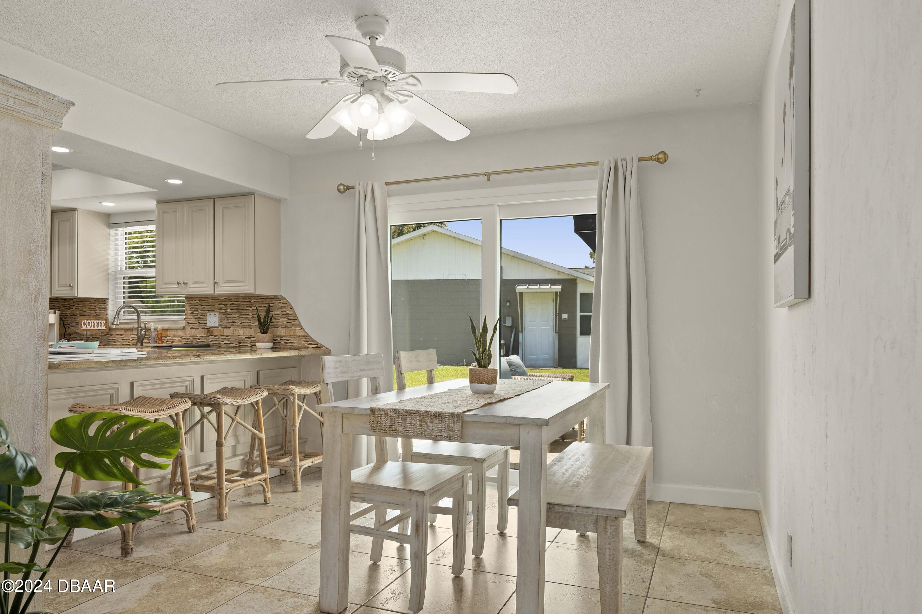 5528 Riverside Drive Port Orange, FL 32127 - Photo 9 of 31 a view of a dining room with furniture window and outside view