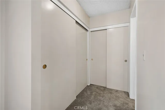 a bathroom with a granite countertop toilet sink and a mirror