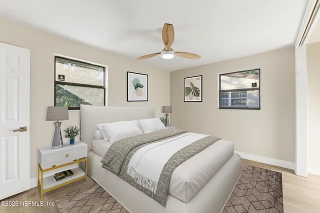 a bedroom with a bed and a window