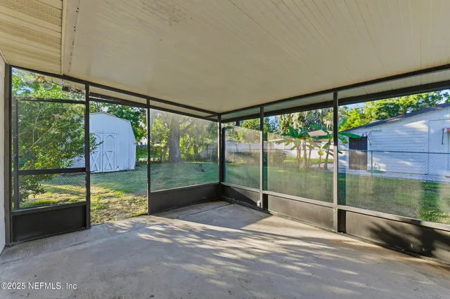 a view of porch with a floor to ceiling window and an outdoor view