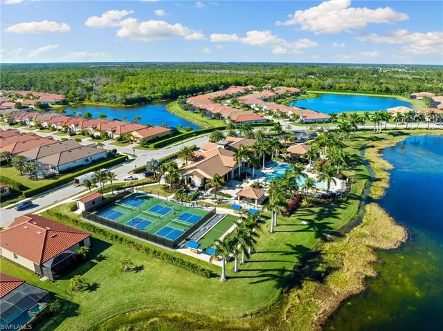 an aerial view of a houses with a lake view