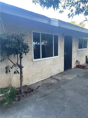 a view of a house with a yard and garage