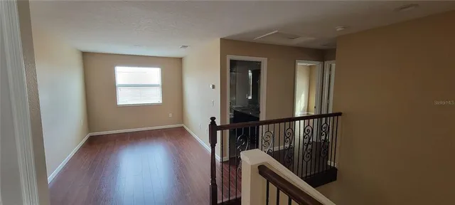 a view of entryway with wooden floor