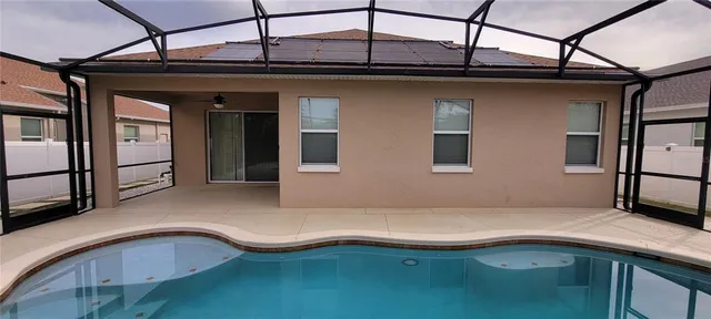 a kitchen with kitchen island stainless steel appliances granite countertop a sink