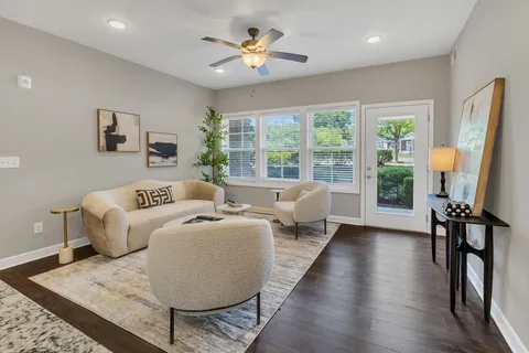 a living room with furniture and a large window
