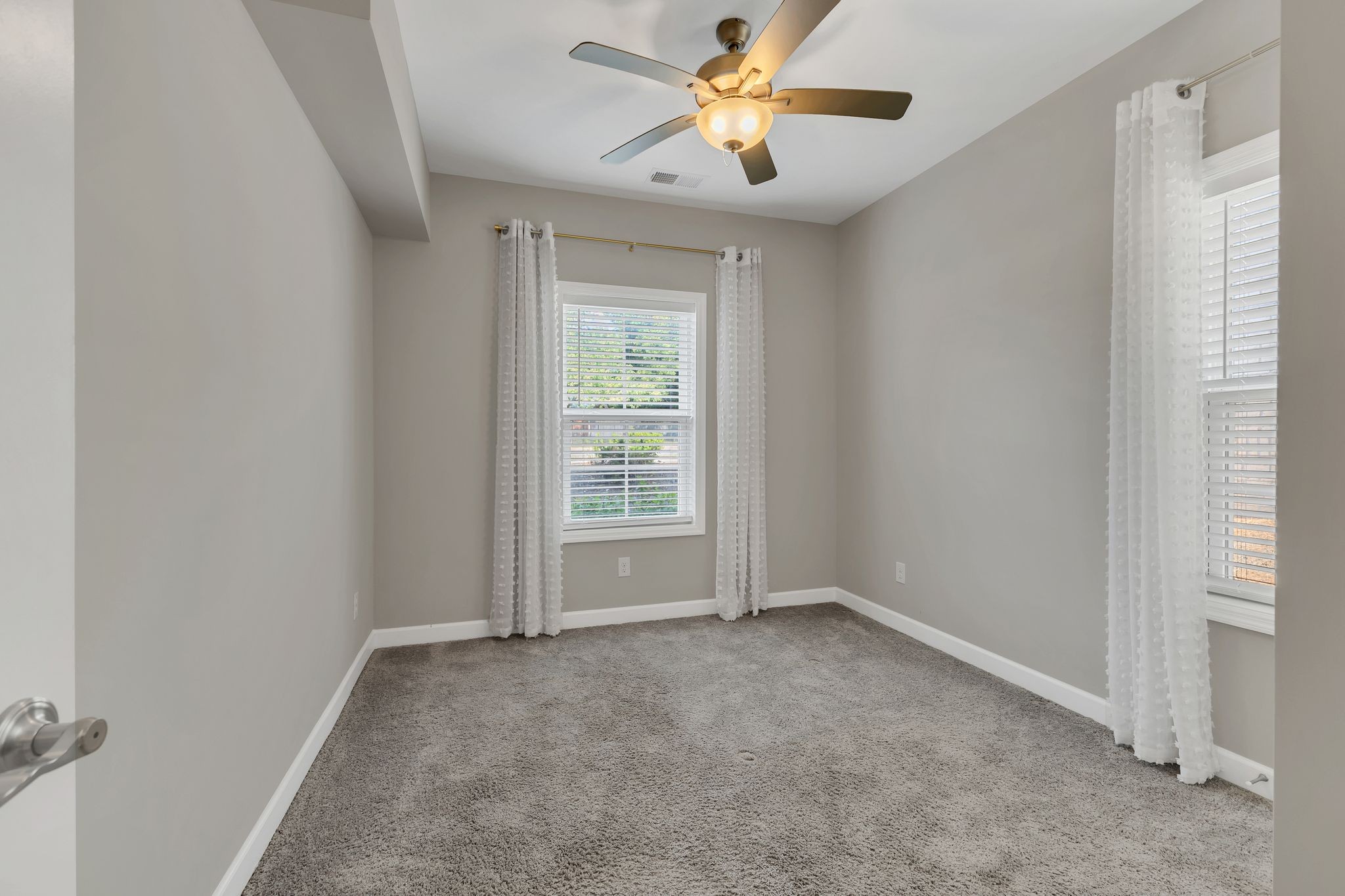 7487 Highway 70 South, Unit 101 Nashville, TN 37221 - Photo 15 of 20 an empty room with windows and fan