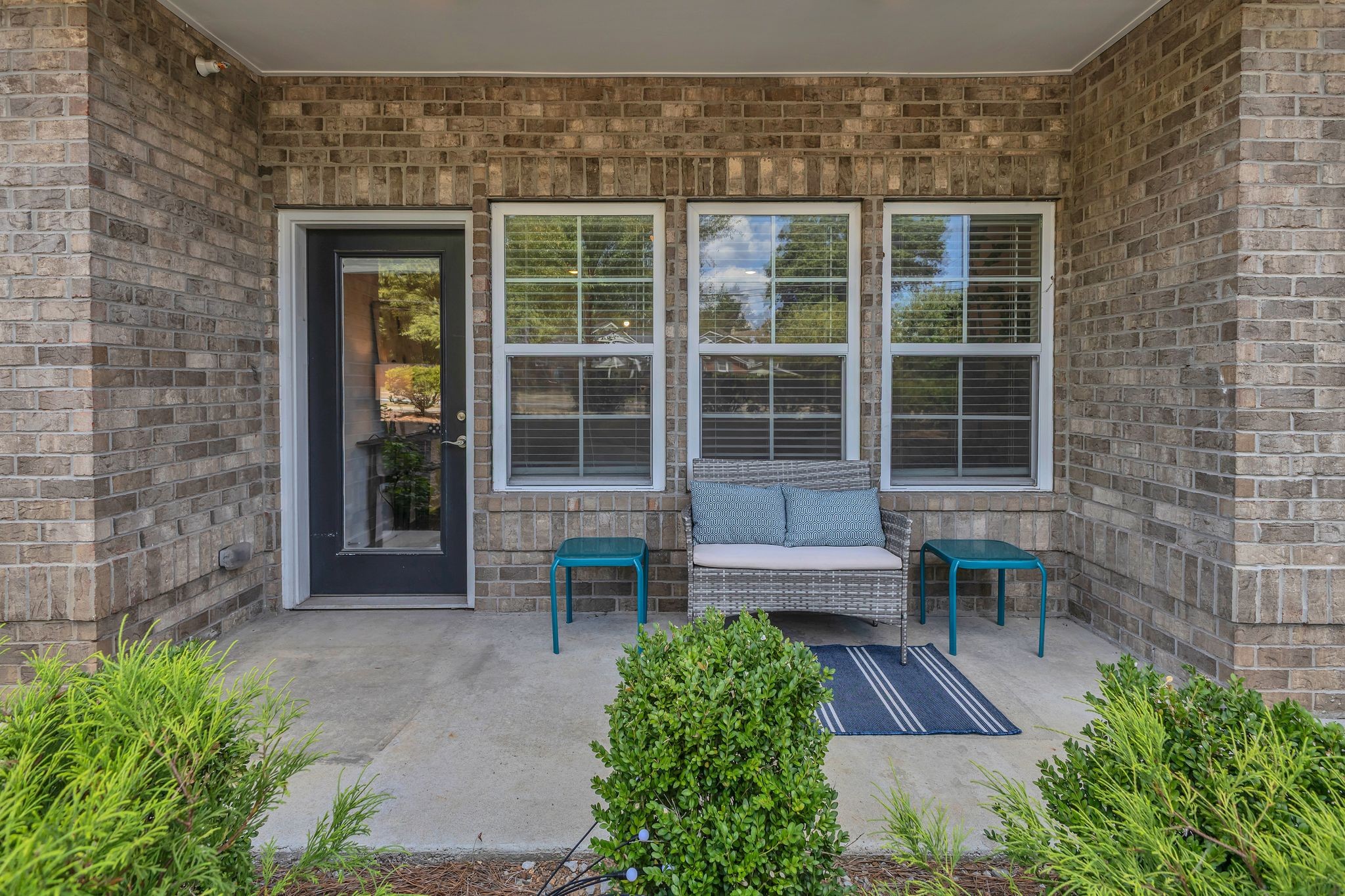 7487 Highway 70 South, Unit 101 Nashville, TN 37221 - Photo 18 of 20 a view of front door of house with an outdoor space